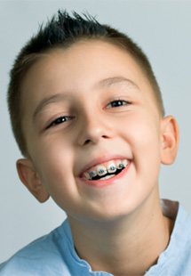 a child wearing braces near Joshua