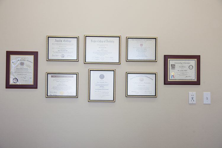 Certificates and diplomas on wall